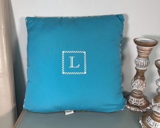 Frontgate blue patio pillow with 'L', some wear/staining 18"W