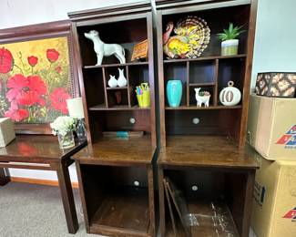Pair of shelves with modular central storage and shelves below, good condition with major scratches on some surfaces 6'2"H x 24"W x 23"D