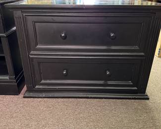 Two-drawer black chest with some wear to surface, opens easily 29"H x 40"W x 19"D