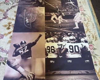 Football collage photographic print on canvas-like fabric with tubular aluminum top & bottom frame, some wear (top corner needs re-glued into tube) 72"H x 48"W