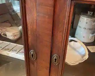 Estate of Jon & Emma Cram, Marietta, Ohio.  Period mahogany cabinet with center pull drawer, original glass, slight in size.  This piece would be beautiful in living area, bedroom and dinning ares.  Perfect size.