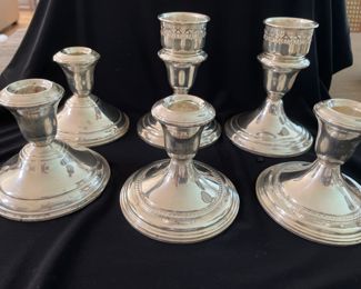 Several options of sterling candle holders