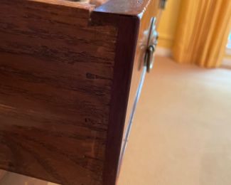 A George IV mahogany bow fronted sideboard, 19th century, with arched napery drawer, left drawer, cellaret on right, on four tapered and ring turned legs.