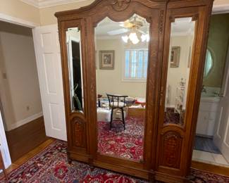 Beautifully carved armoire with carving and custom shelves