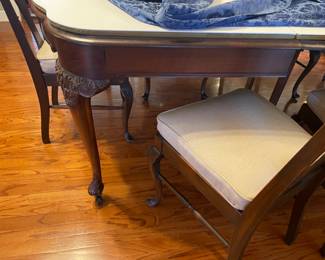 Beautiful carved antique dinning table with 6 legs (2 center legs) with 4 leaves, custom table pad.