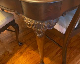 Beautiful carved antique dinning table with 6 legs (2 center legs) with 4 leaves, custom table pad.