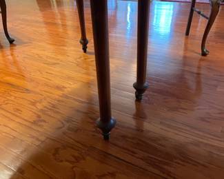 Beautiful carved antique dinning table with 6 legs (2 center legs) with 4 leaves, custom table pad.