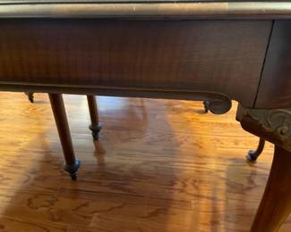 Beautiful carved antique dinning table with 6 legs (2 center legs) with 4 leaves, custom table pad.