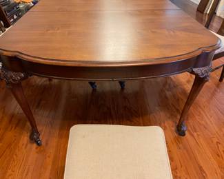 Beautiful carved antique dinning table with 6 legs (2 center legs) with 4 leaves, custom table pad.