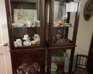 Two separate lighted cabinets