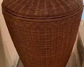 This wicker basket would be great for a clothes bin.  It is about 3' tall.