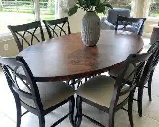 Arhaus copper top dining table with chairs