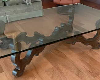 $200 	
#10 Mediterranean style wood base stretcher coffee 									
"table with thick 1/2"" beveled glass top 66x36x16"		