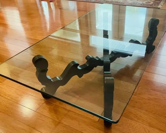 $200 	
#10 Mediterranean style wood base stretcher coffee 									
		"table with thick 1/2"" beveled glass top 66x36x16"		