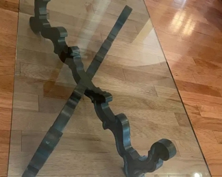 $200 	
#10 Mediterranean style wood base stretcher coffee 									
table with thick 1/2"beveled glass top 66x36x16"	