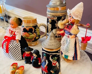 $60 	"
#64 German lot Steins, & dolls 7 pieces "	