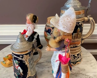 $60 	"
#64 German lot Steins, & dolls 7 pieces "	