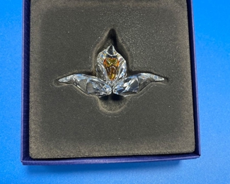 $36 	
#75 Swarovski flower 	