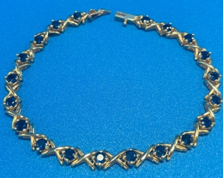 #107 - $450 - 14kt gold tennis bracelet with 21 sapphire 7" bracelet - 11.81 gr.  We have appraisal. Purchased at Bere Jeweler. 
