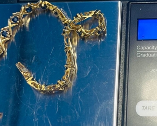 #107 - $450 - 14kt gold tennis bracelet with 21 sapphire 7" bracelet - 11.81 gr. We have appraisal. Purchased at Bere Jeweler. 