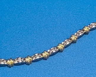 #137 -$1,575.00 - 14kt gold tennis bracelet diamonds composed of 12 white gold links, each set with 3 round brilliant cut diamonds, separated by gold textured links. Total diamonds 2 carats. Color: G/H Clarity :Si2. The bracelet weight 21 grams. Measures 7.5” in length 