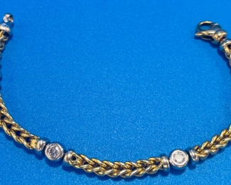 #133 $2450 18kt gold bracelet with 4 diamonds ITALY ladies gold woven bracelet set with 4 round brilliant diamonds, each weighting 0.25 by measurement. Bracelet weight 34 grams. Diamond color : H , clarity S1 1/2@