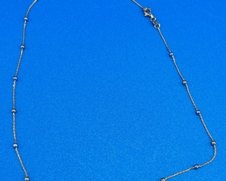 #145 - $136 - 18kt yellow gold / silver balls 4.26gr