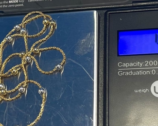 #145 - $136 - 18kt yellow gold / silver balls 4.26gr