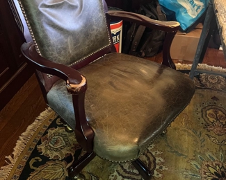 Leather office chair and gray carpet 