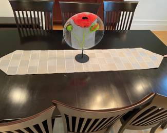 Ebony Dining Table with 3 leaves and 8 chairs.