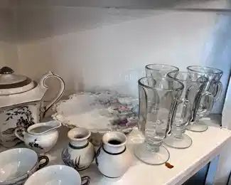 tea set, glass drinking glasses, miniature vases,