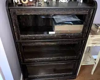 wood and glass bookshelf,