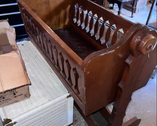 swinging antique cradle,