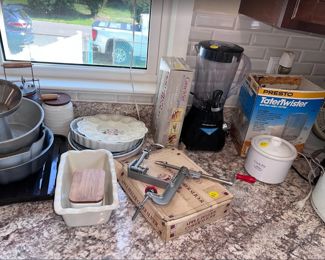 apple corer, tater twister, small crock pot, blender, electric carving knife, bread dish, egg plate,