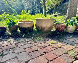 Large assortment of sizes of planters