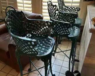 Green wrought iron chairs, leather chair