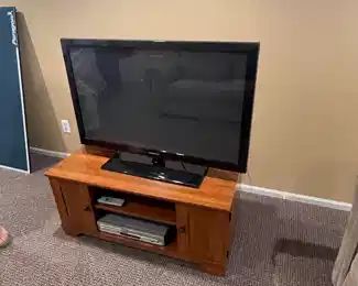 Samsung Smart TV and Wood Entertainment Stand 