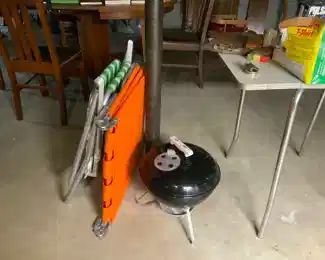 Lounge chairs and small grill