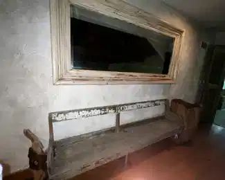 Really long mirror over bench