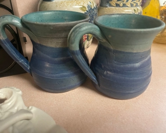 Signed pottery mugs