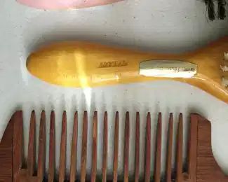 Hand-carved wood comb signed