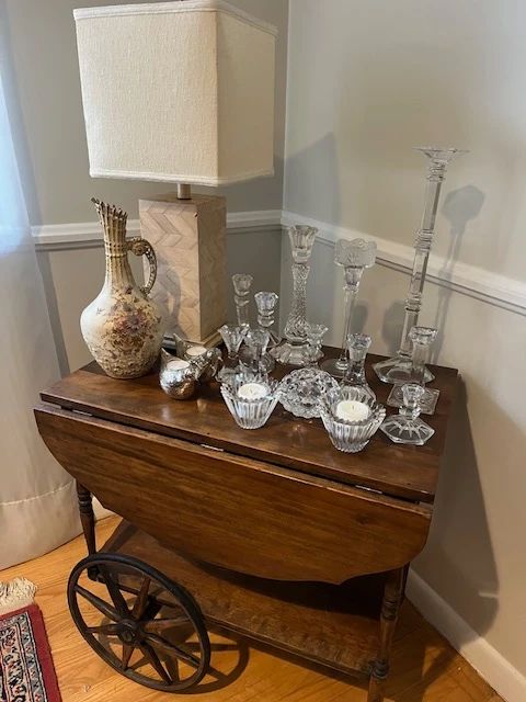 antique cart and crystal candlesticks
