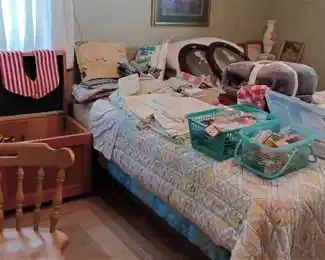 The second bedroom, with linens, sewing machines, sewing notions, crafts and more