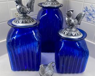 Beautiful cobalt blue canister set with decorative rooster tops