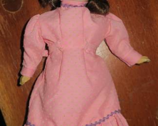 Antique doll, originally a pin cushion, she has a bisque head and is marked Made in Germany with crossed 'F's' on the back of head.