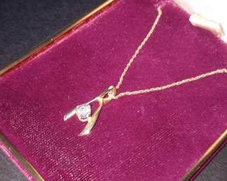 14k Yellow gold chain, wishbone pendant with Calvin diamond .32ct 
