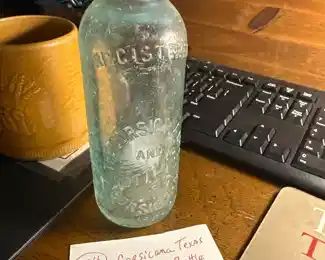 Collection of Hutchinson soda bottles from Texas towns. 
