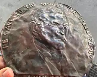 very old John Deere brass sign