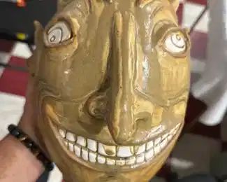 Labarga pottery, big mustard yellow grinning devil face jug