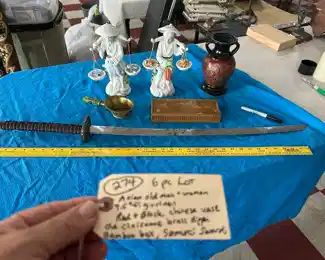 old samurai swoard, old man and woman figurines, more